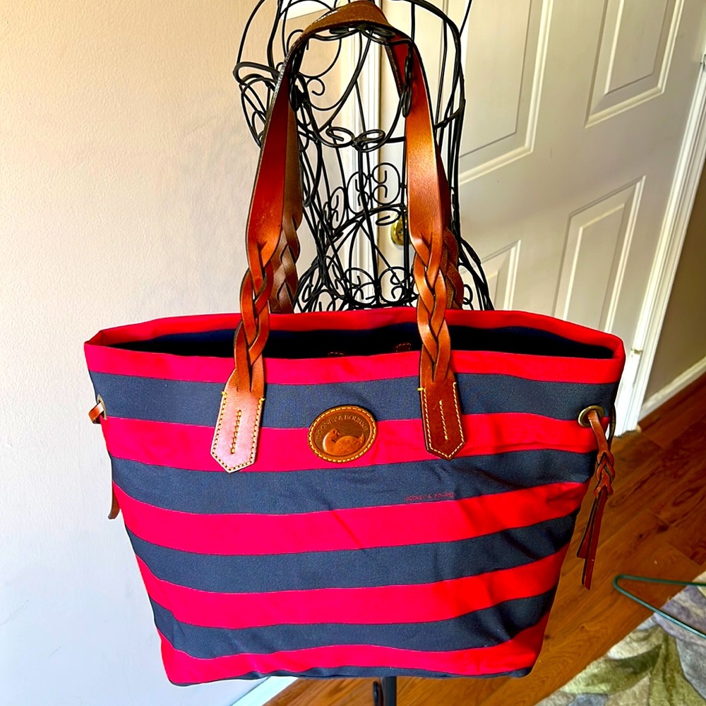 Dooney & Bourke canvas tote with braided leather accents. Great bag like new.